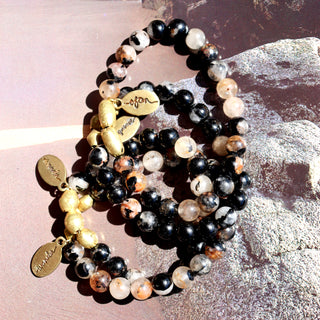 Black tourmaline beaded bracelets with brass accents.