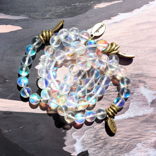 Angel Aura Quartz Beaded Bracelet shining with little rainbows inside the beads.