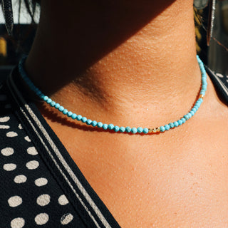 Faceted light blue turquoise to give a subtle sparkle. 14k Gold Fill chain is adorned with a draping “Often Wander” charm down the back.