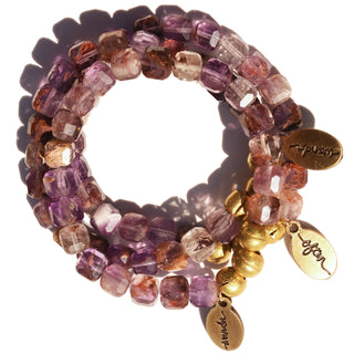 Super 7 Cube Shaped Beads on a bracelet with a fusion of seven different crystals, along with an accent of 3 brass beads & a brass Often Wander Charm