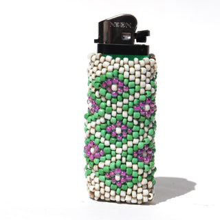 A green and white beaded lighter sleeve with purple floral accents, fitted on a black NEON lighter, set against a plain white background.
