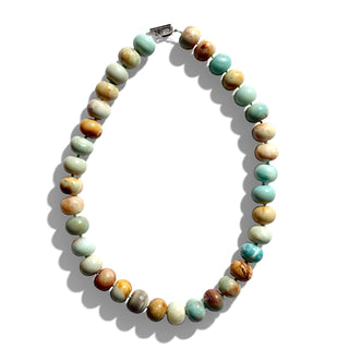 Necklace with multicolored beads on a white background
