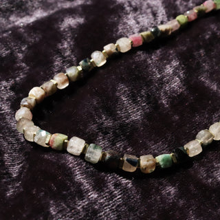Cubed Rainbow Tourmaline beads in Dark Green, Green, Clear, Purple beads with gold spacers between each bead. 