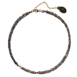 bold labradorite beads that are grey with flashes of blue in the light along with gold accent beads & The 14k Gold Fill chain is adorned with a draping “Often Wander” charm down the back.