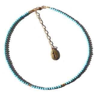 Faceted light blue turquoise to give a subtle sparkle. 14k Gold Fill chain is adorned with a draping “Often Wander” charm down the back.