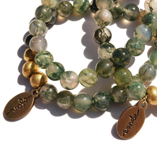 Moss Agate Beaded Bracelet. Looks like little pieces of moss in each bead, along with 3 brass accent beads and an Often Wander charm.