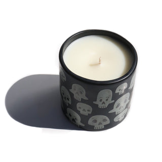a black jar with grey skull characters printed onto the jar, the scent is smoke.