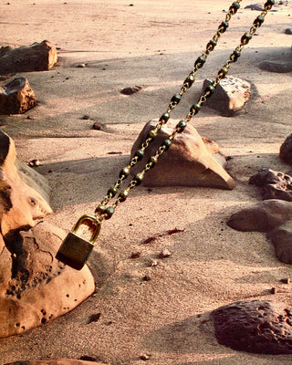 pyrite rosary chain with a mini lock pendant.