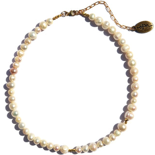 classic pearl necklace with a few small gold bead accents.
