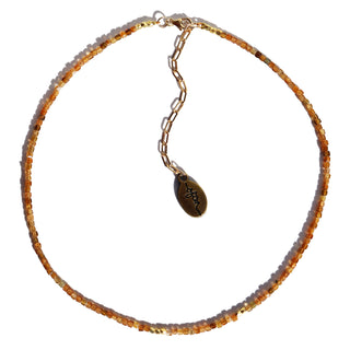 petite golden tourmaline beads with a few gold accent beads. The 14k Gold Fill chain is adorned with a draping “Often Wander” charm down the back.