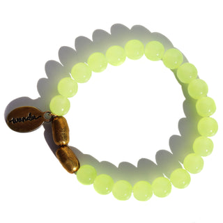 neon green glass beads with brass accent beads and an Often Wander charm.